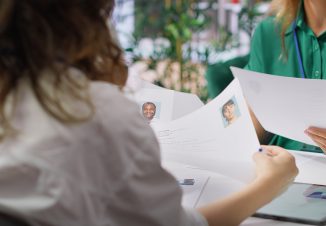 Human resources staff evaluating candidates resume in the selection process