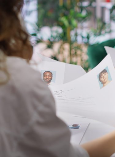 Human resources staff evaluating candidates resume in the selection process
