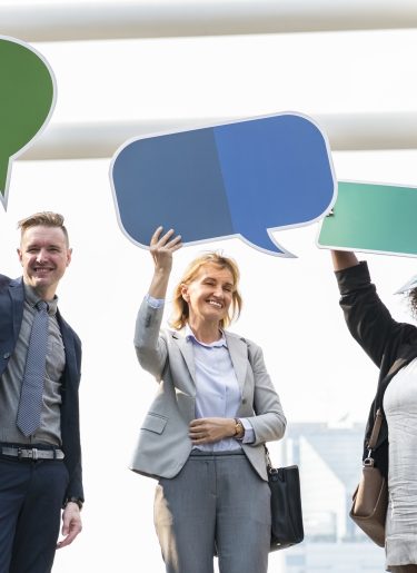 Business professionals with colourful speech bubbles