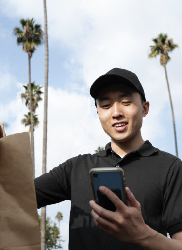 Delivery man getting parcel out