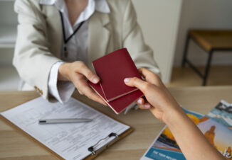 Woman receiving two passports