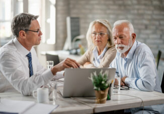 Senior couple and financial advisor in a meeting