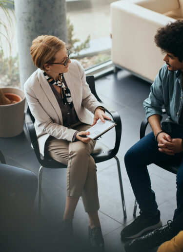 Above view of counseling during group therapy at mental health center.