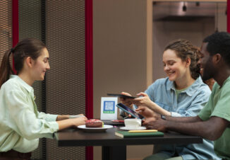People consulting a menu on their phone