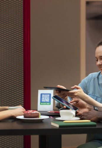 People consulting a menu on their phone