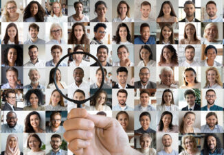 Hr holding magnifying glass choosing african candidate among people faces