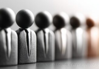 Business figurines in suits representing a flexible workforce.