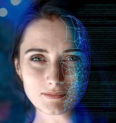 Portrait of a woman symbolically turning into virtual human, virtual character, or digital clone, using computer-generated from the real persona. AI artificial intelligence.